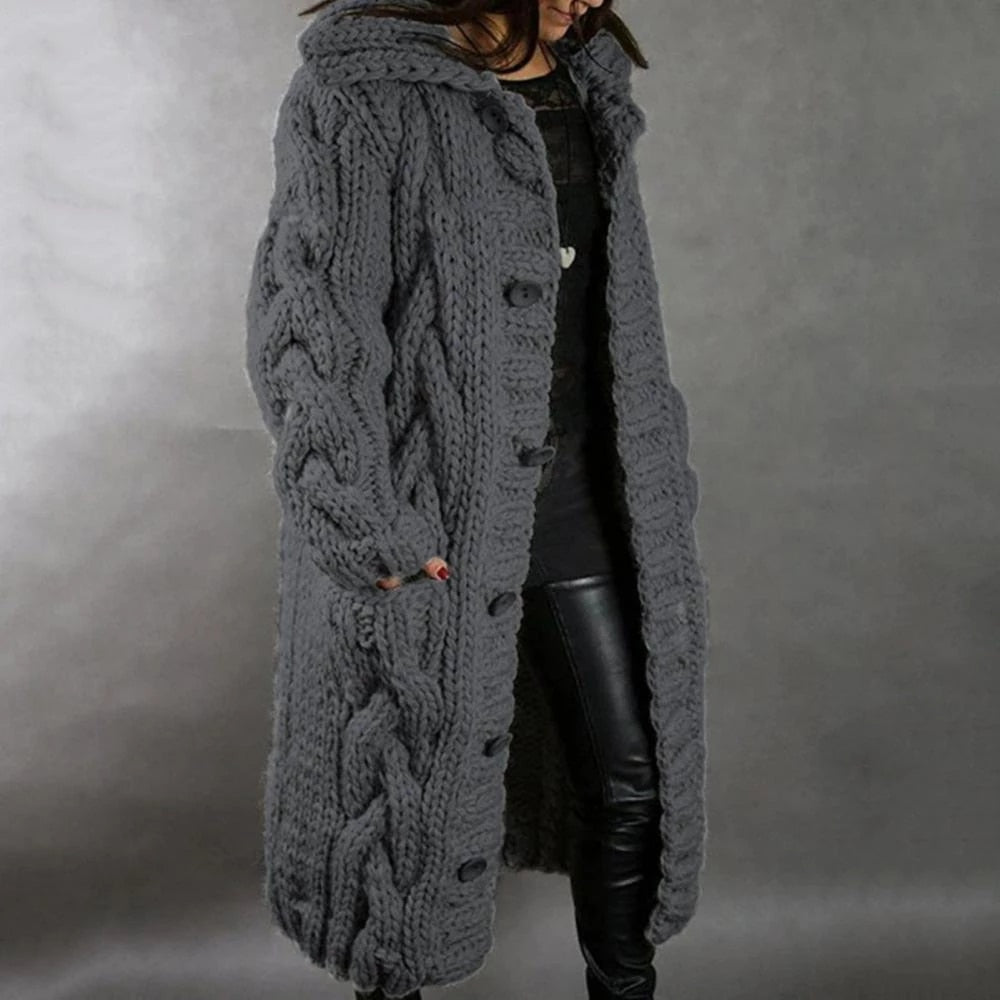 Women's long cable knit cardigan in cozy winter style with classic textured pattern and relaxed silhouette