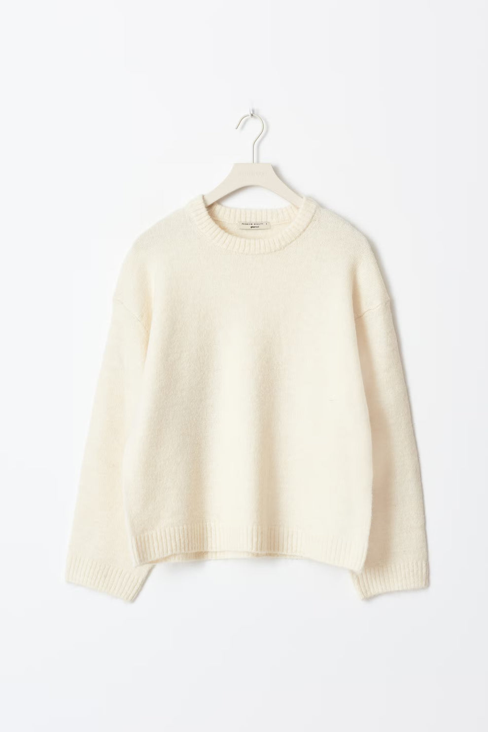 Chunky knit oversized women's pullover sweater in neutral tones with dramatic balloon sleeves