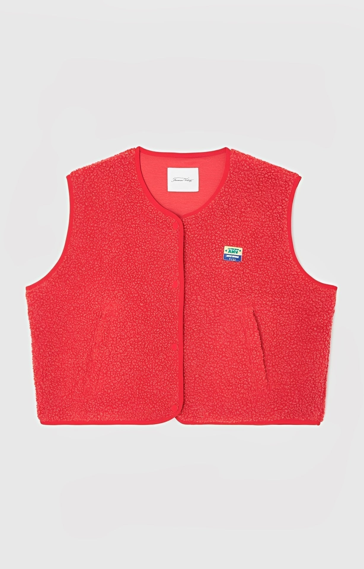 Women's sleeveless vest with simple button closure, versatile layering piece for effortless everyday style