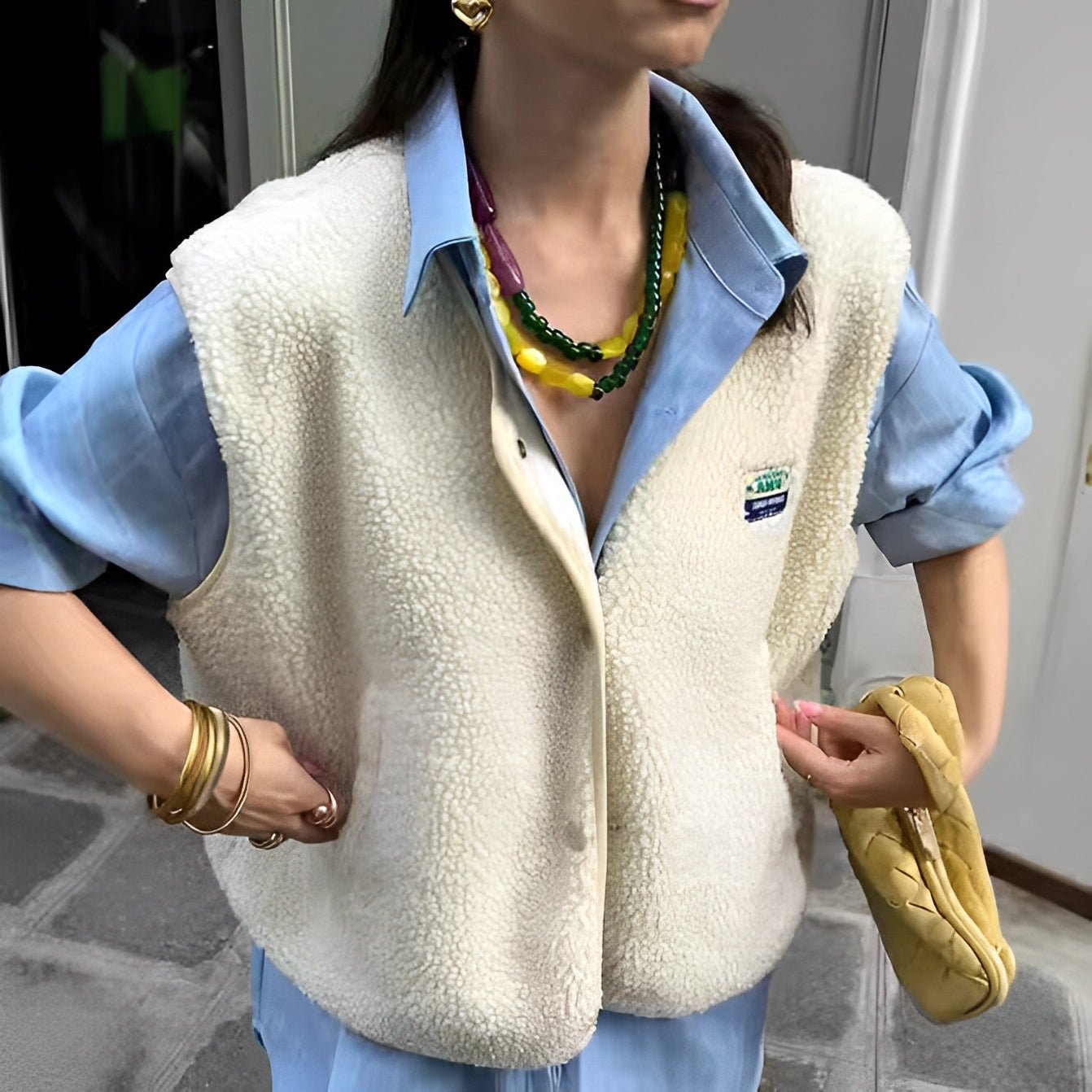 Women's button-front vest timeless layering piece with clean streamlined closure for everyday elegance