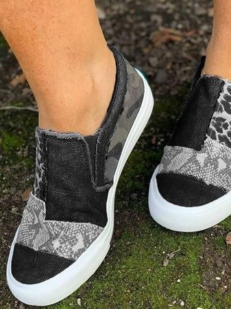 Women's canvas slip-on loafers in animal print pattern, low-profile casual style with rubber sole