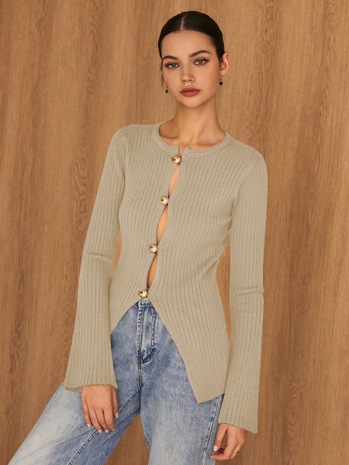 Women's ivory split knit top with gold button detail, elegant relaxed fit with subtle stretch