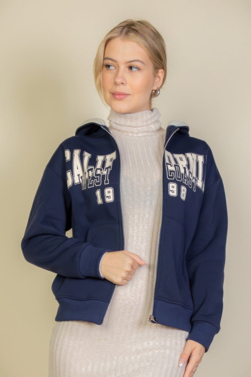 Black oversized drop shoulder zip-up hoodie with bold graphic print, unisex streetwear style
