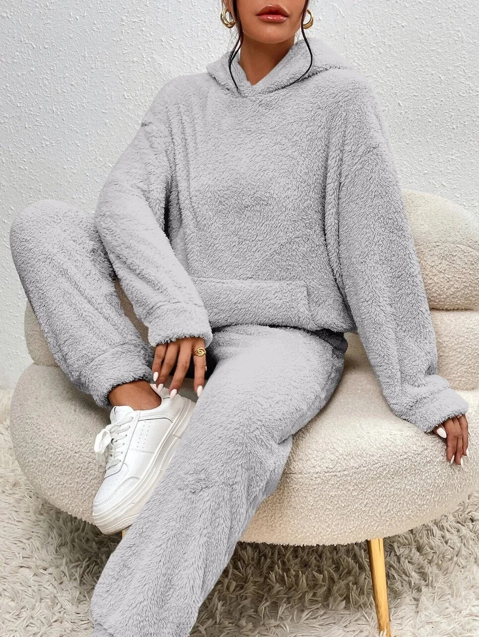Women's soft plush two-piece lounge set in cozy relaxed fit, perfect matching top and bottom combo