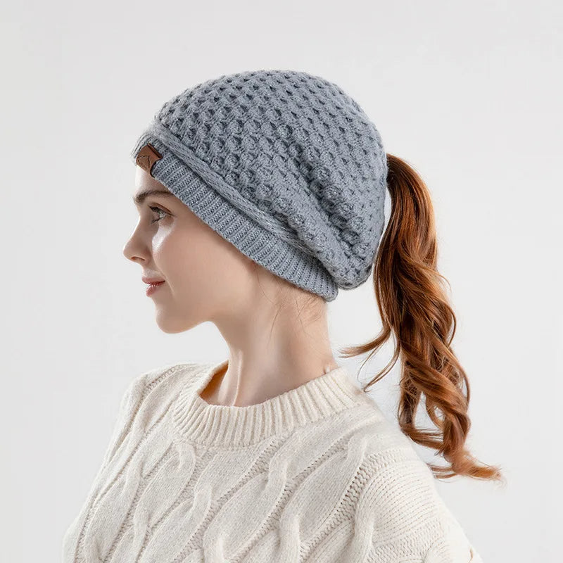 Women's slouchy textured knit wool beanie with ponytail opening, cozy soft fit for all-day warmth