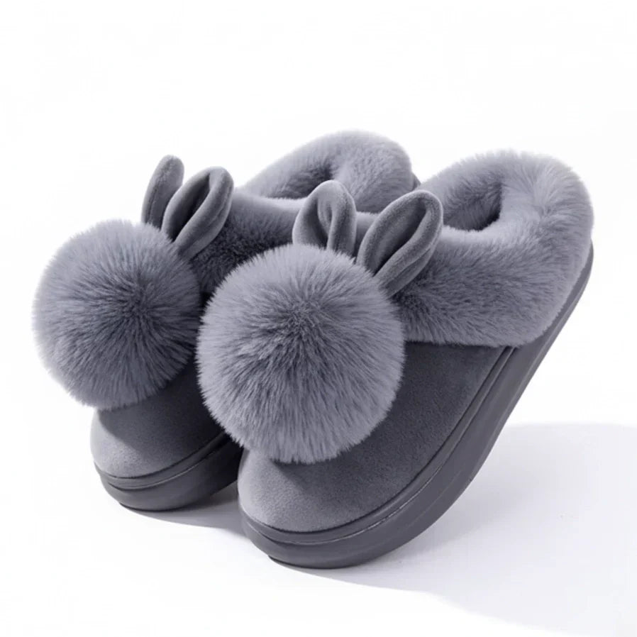Women's beige plush slip-on slippers with cozy fur trim and playful bunny ears for home warmth