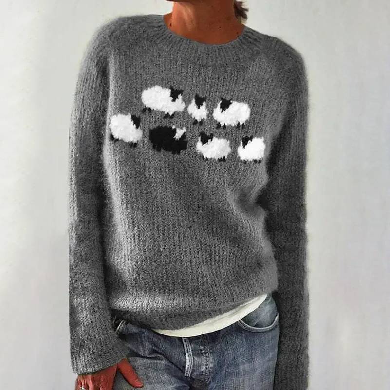 Women's cozy cream knit sweater with playful all-over sheep pattern, soft plush fabric for layering