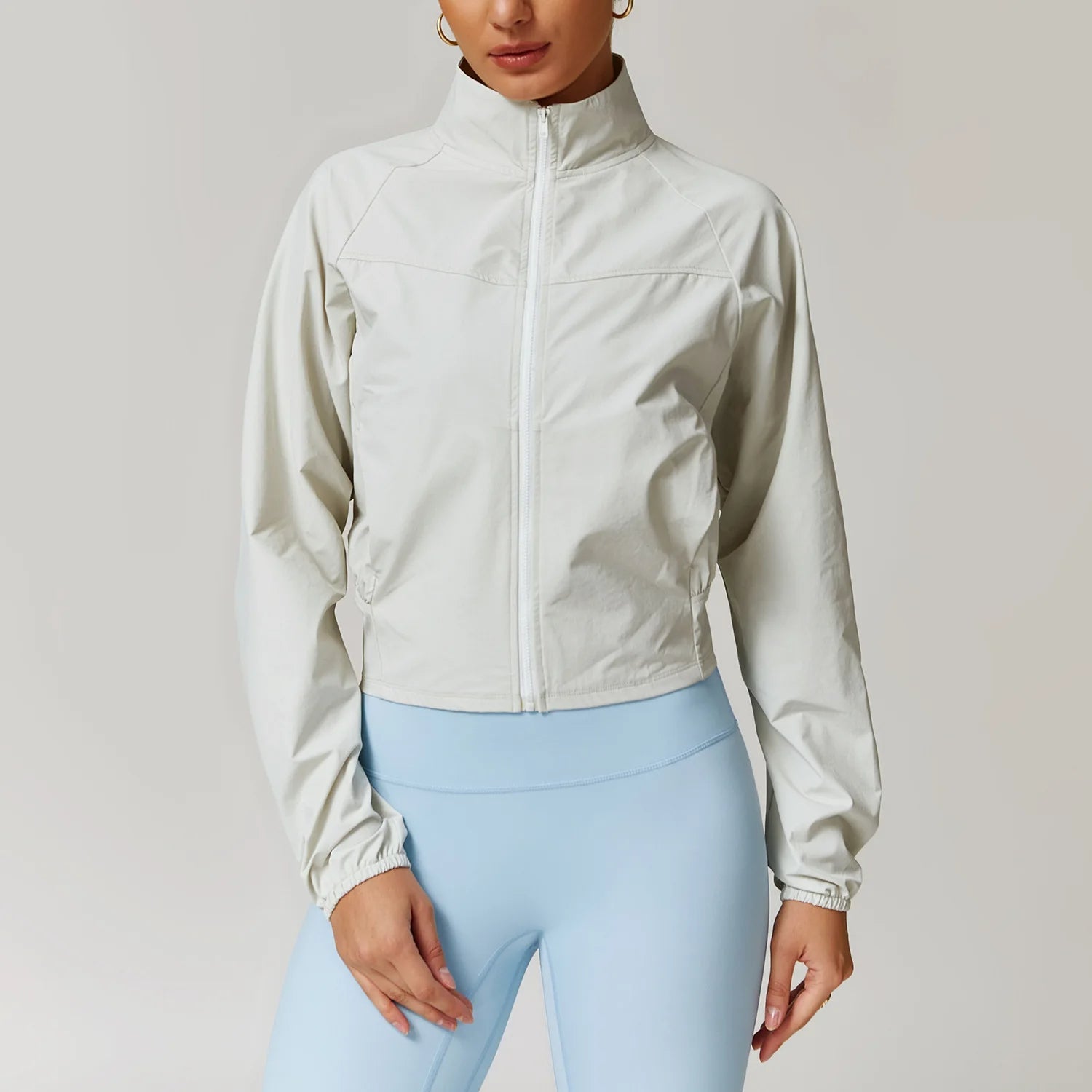 Lightweight black performance jacket with stand-up collar, tailored fit, wind and water-resistant stretch woven