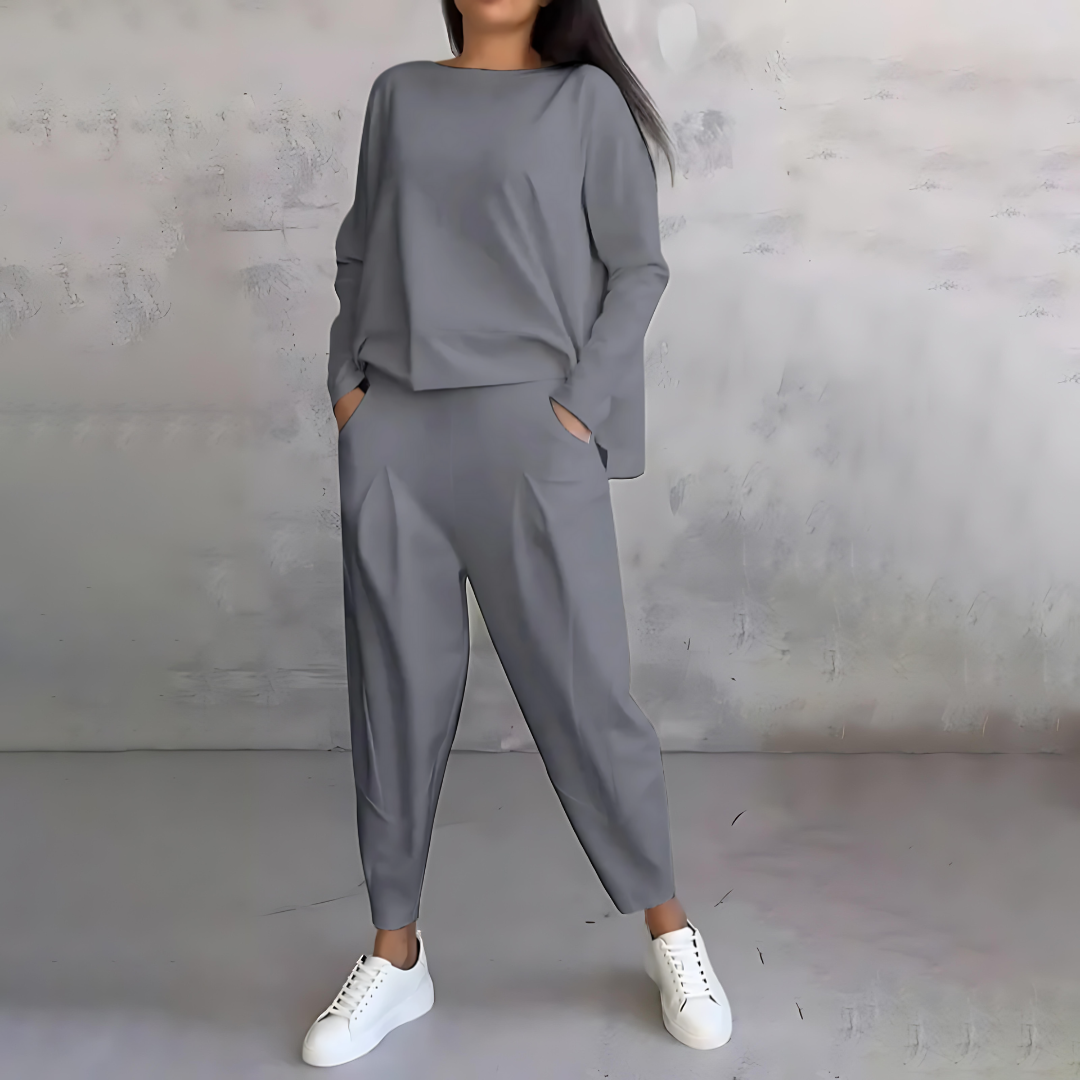 Women's loose fit two-piece set with flowy long-sleeve top and tapered pants for chic travel style