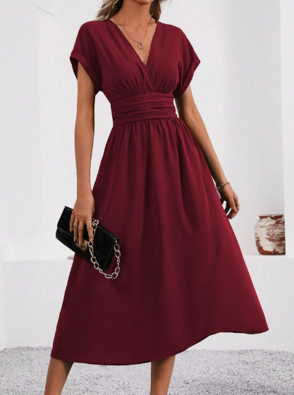 Women's black pleated midi dress with deep V-neck defined waist and flared hem for elegant comfort