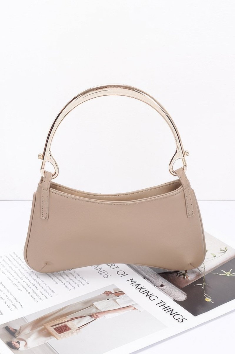 Structured faux leather shoulder bag with polished metallic top handle, day-to-night versatile design