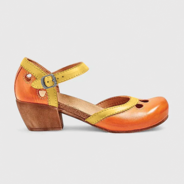 Women's black Mary Jane shoes rounded toe buckle strap cutout details timeless elegant silhouette