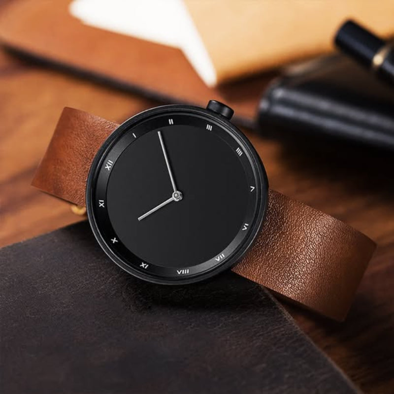 Men's minimalist leather wristwatch with Roman numeral dial, slim profile, timeless elegant design