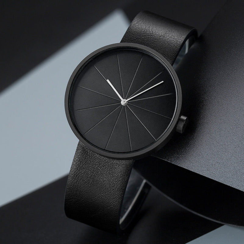 Men's minimalist round case wristwatch leather strap geometric segmented dial everyday elegance