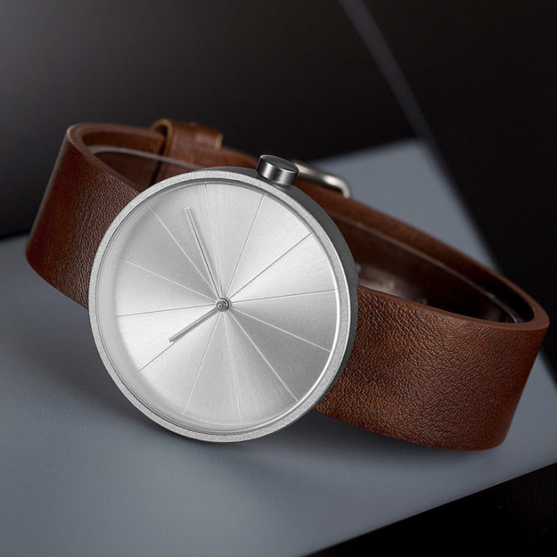 Men's minimalist round case wristwatch leather strap geometric segmented dial everyday elegance
