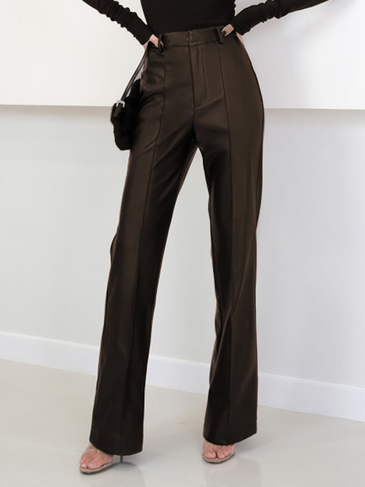 Women's black high waist faux leather pants regular fit long length with split hem detail