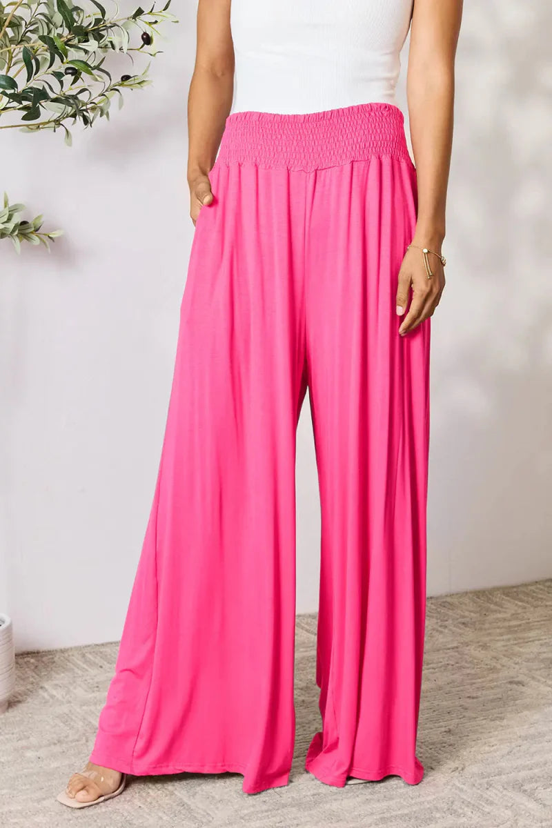 Women's high-waisted wide-leg pants with smocked waistband, relaxed silhouette in casual chic style
