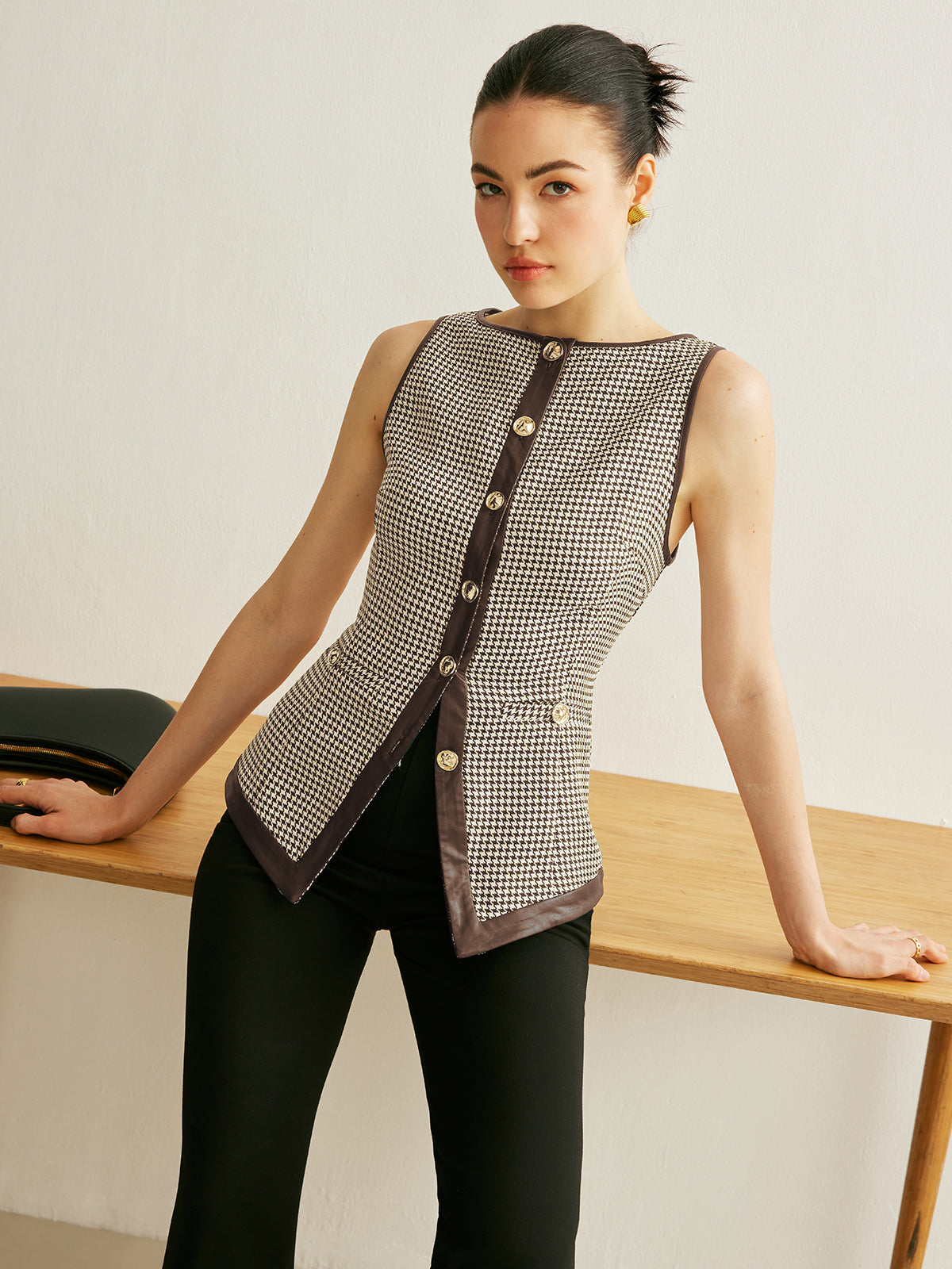 Women's black white houndstooth sleeveless vest with contrast trim buttons, chic tailored fit