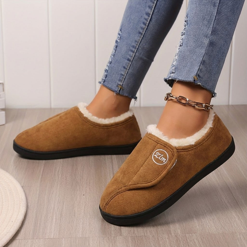Women's wide fit fleece-lined slippers with adjustable strap and non-slip grip for winter comfort