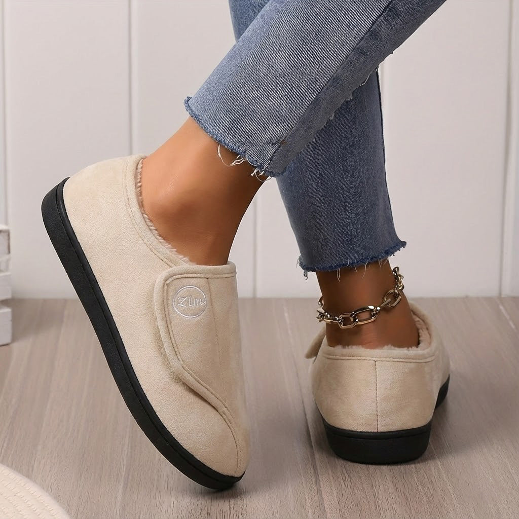 Women's wide fit fleece-lined slippers with adjustable closure and non-slip grip sole