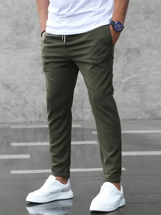 Men's dark stretch tapered pants with flexible comfort waistband for office and everyday wear