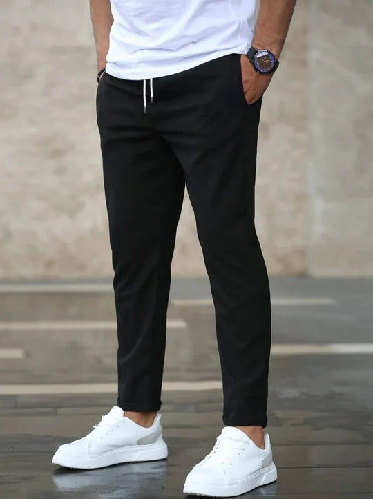 Men's charcoal stretch tapered pants with flexible comfort fabric for office and everyday wear