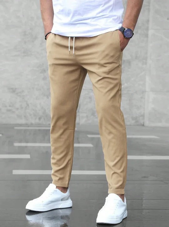 Men's charcoal stretch tapered pants with flexible comfort fabric for office and everyday wear