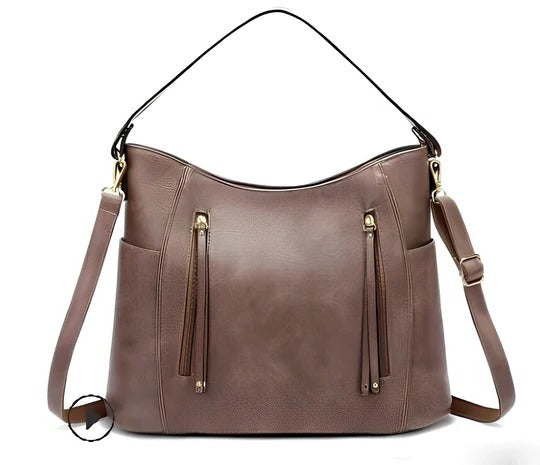 Women's vintage brown leather crossbody bag with magnetic flap closure and adjustable strap