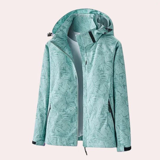 Women's camouflage hooded jacket with detachable hood, breathable fabric, and functional pockets