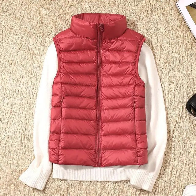 Women's lightweight sleeveless puffer vest insulated packable layer for travel and outdoor adventures