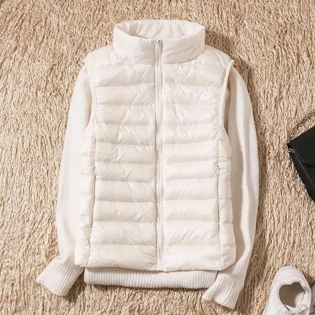 Women's lightweight sleeveless puffer vest, packable insulated layer for travel and outdoor adventures