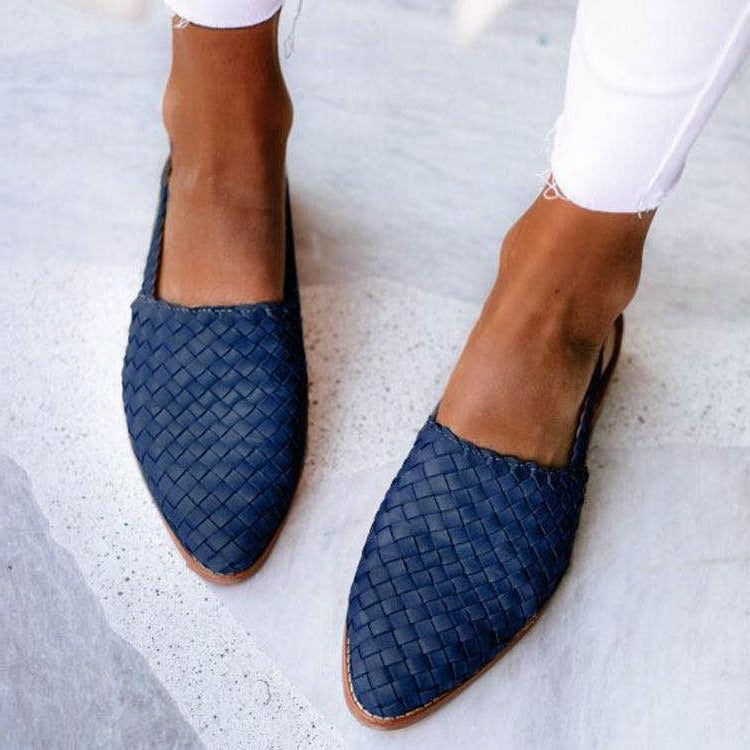 Women's closed-toe woven flats in neutral tone, structured upper, flat sole for all-day comfort