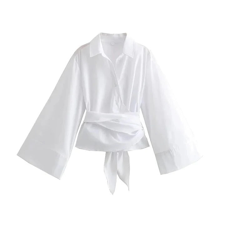 Ivory long-sleeve office blouse with wide bow belt cinched waist polished professional silhouette