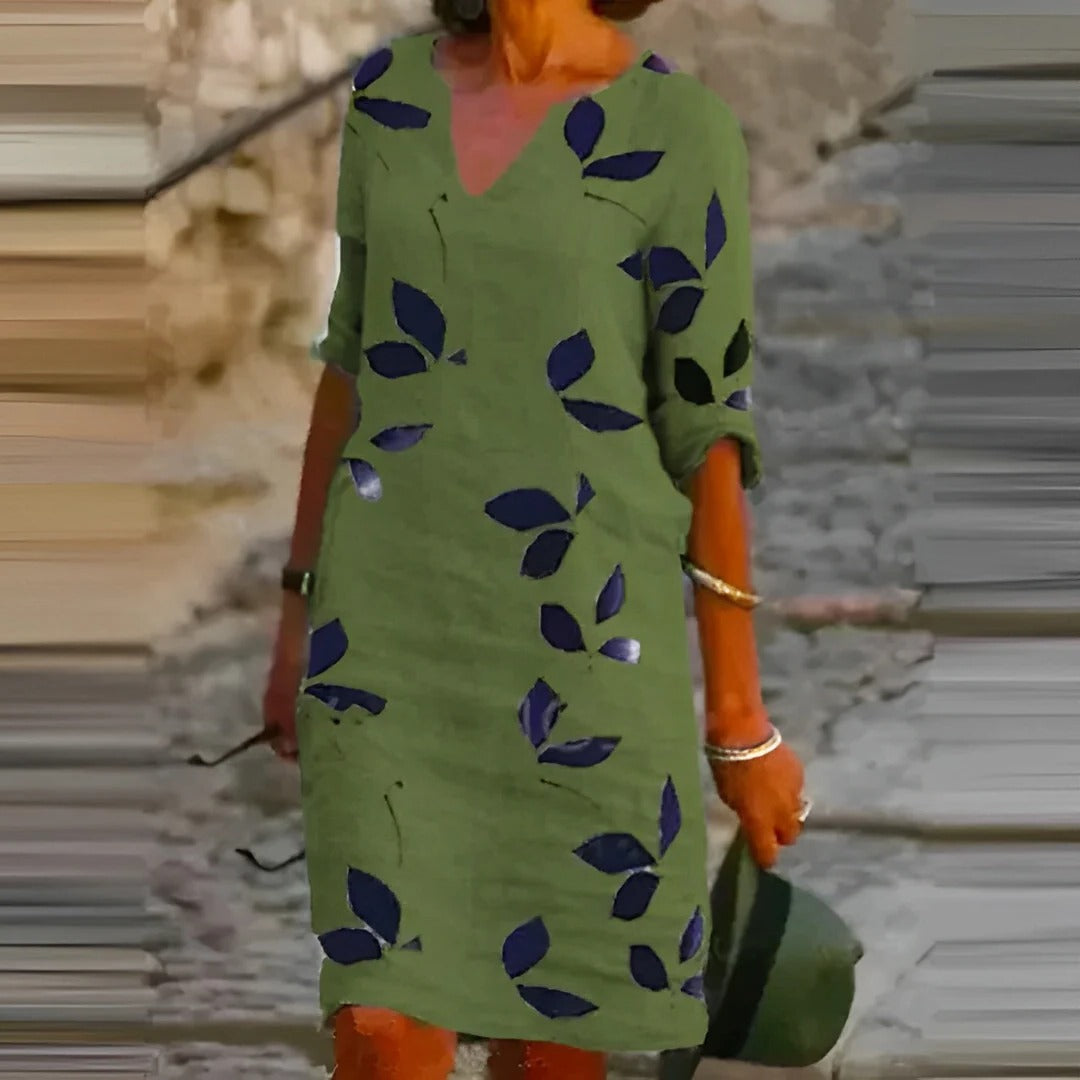 Women's green leaf print A-line knee-length dress with V-neck, breathable fabric for easy movement