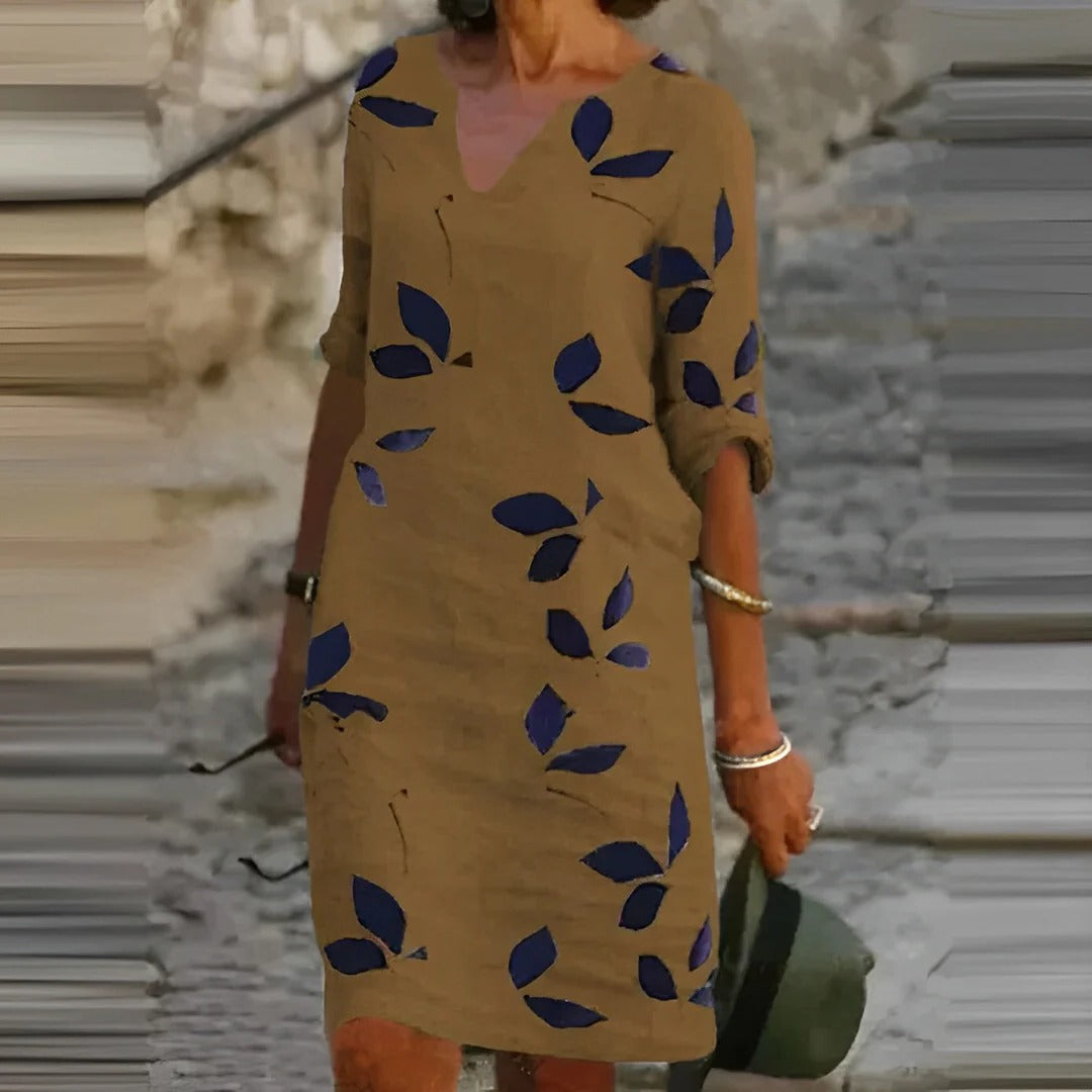 Women's green leaf print A-line V-neck knee-length dress with breathable fabric for easy movement