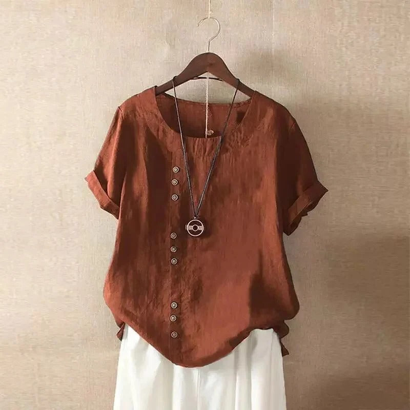 Women's relaxed-fit short sleeve blouse with rounded collar and front button details for office wear