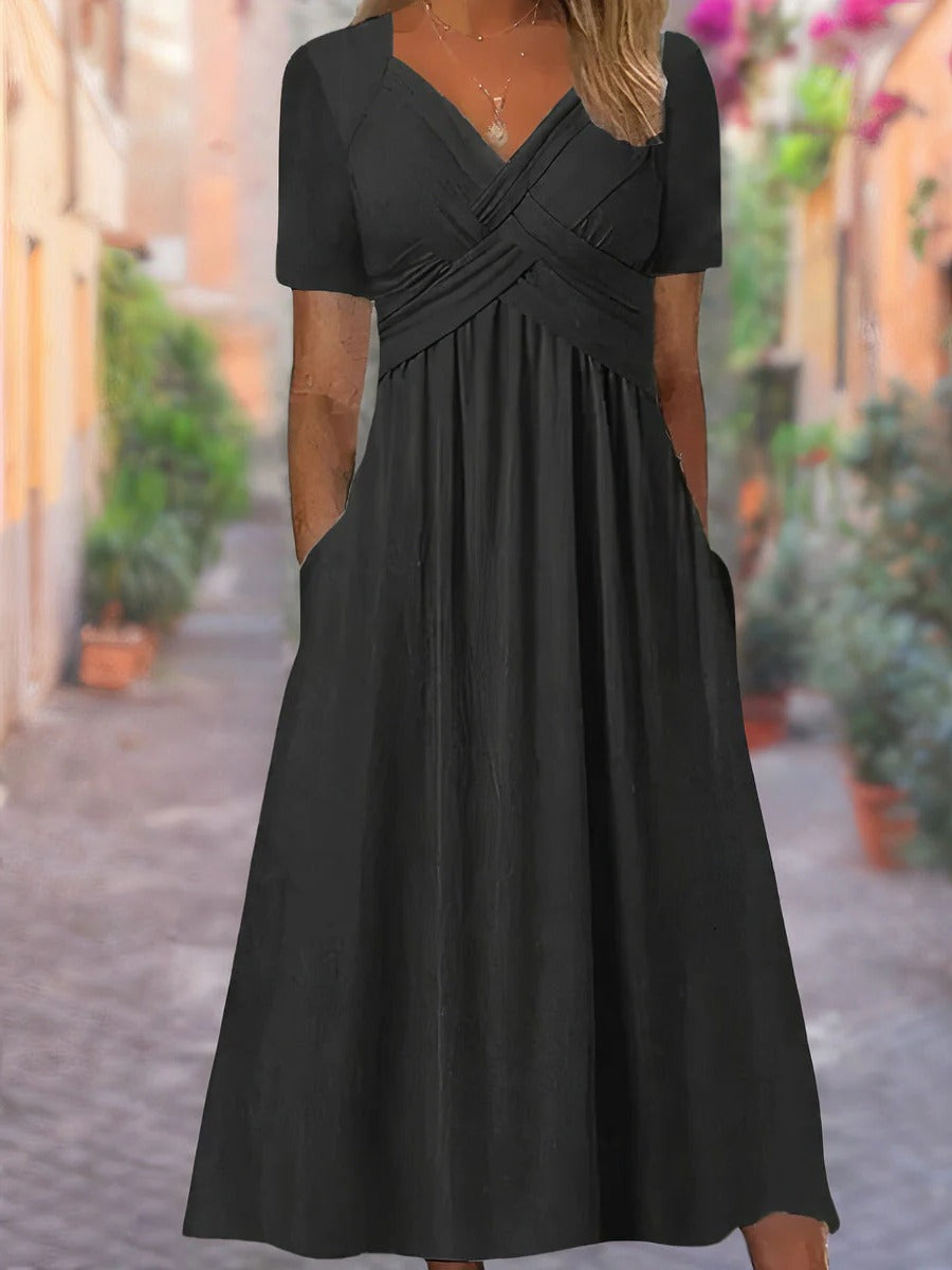 Women's relaxed V-neck summer dress in solid color with clean structured neckline for daytime wear