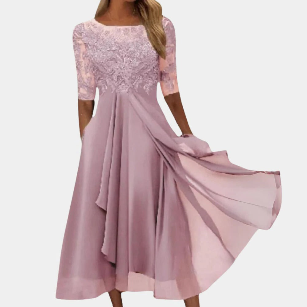 Women's white lace dress with delicate bodice detailing, lightweight summer style for day-to-night wear