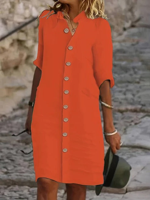 Women's navy shirt dress with button front closure and classic collar, versatile everyday chic style