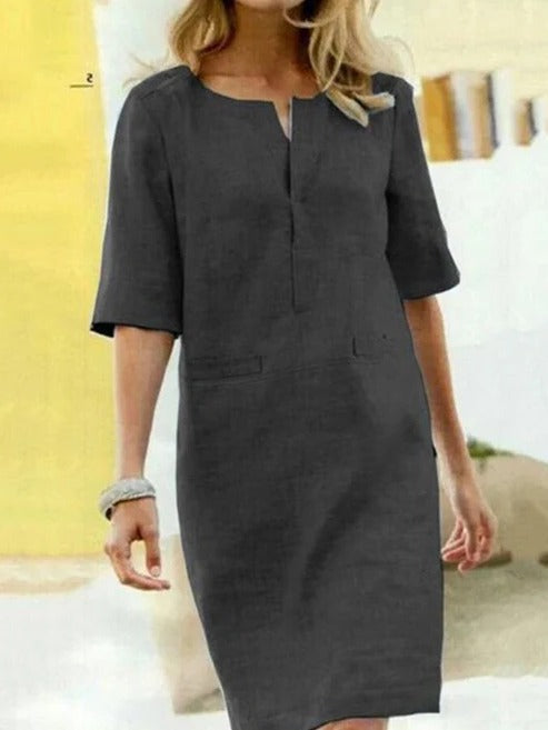 Women's short sleeve summer dress minimalist silhouette clean lines relaxed fit day-to-night versatility
