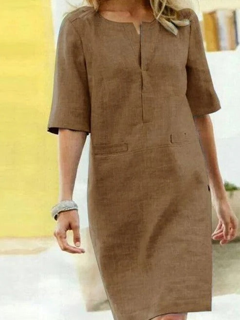 Women's short sleeve summer dress minimalist silhouette clean lines relaxed fit day-to-night versatility