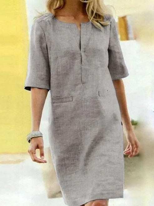 Women's short sleeve summer dress minimalist silhouette clean lines relaxed fit day-to-night versatility
