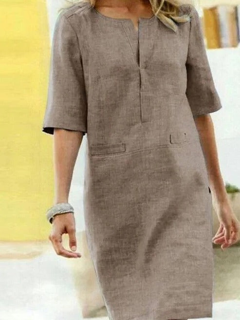 Women's short sleeve summer dress minimalist silhouette clean lines relaxed fit day-to-night versatility