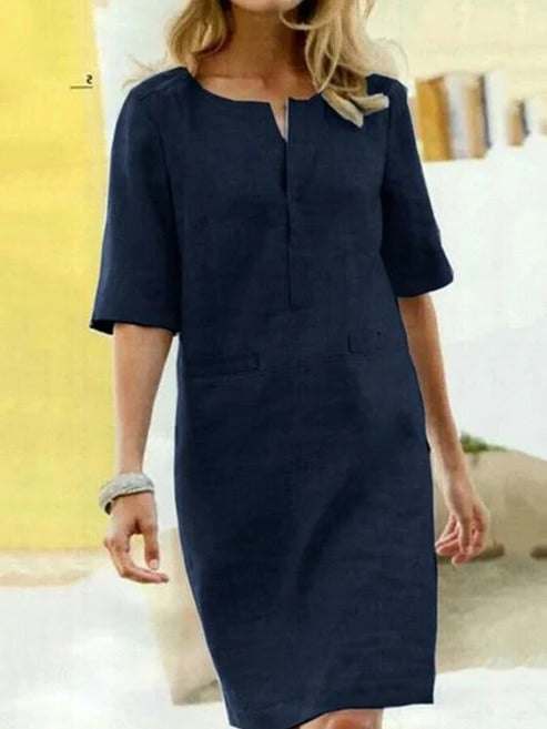 Women's short sleeve summer dress minimalist silhouette clean lines relaxed fit day-to-night versatility