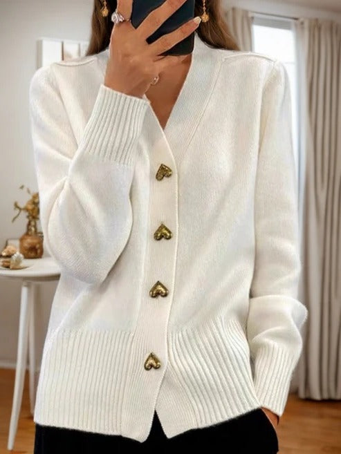 Women's sleeveless knitted cardigan open-front style with pockets, versatile layering piece for year-round wear