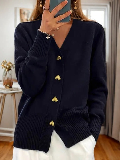Women's sleeveless knitted cardigan open-front style with pockets, versatile layering piece for year-round wear