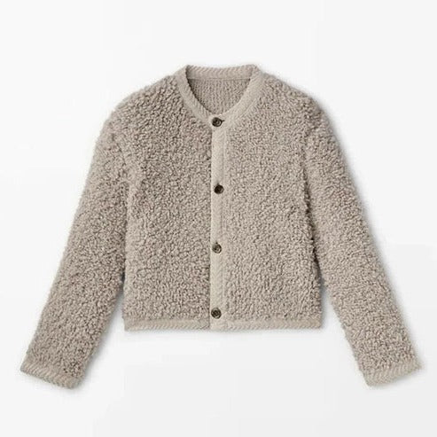 Women's plush teddy fleece jacket in neutral tone, relaxed fit, cozy textured exterior for layering
