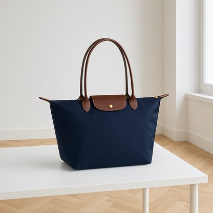 Women's elegant shoulder bag with structured silhouette, spacious interior compartments for professionals daily use