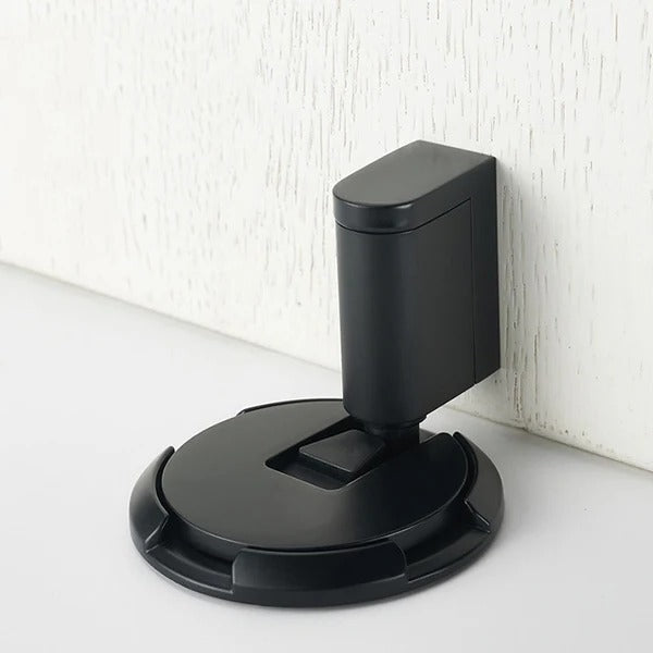Brass adjustable door stopper with magnetic hold, polished gold finish, sleek modern hardware for silent door control