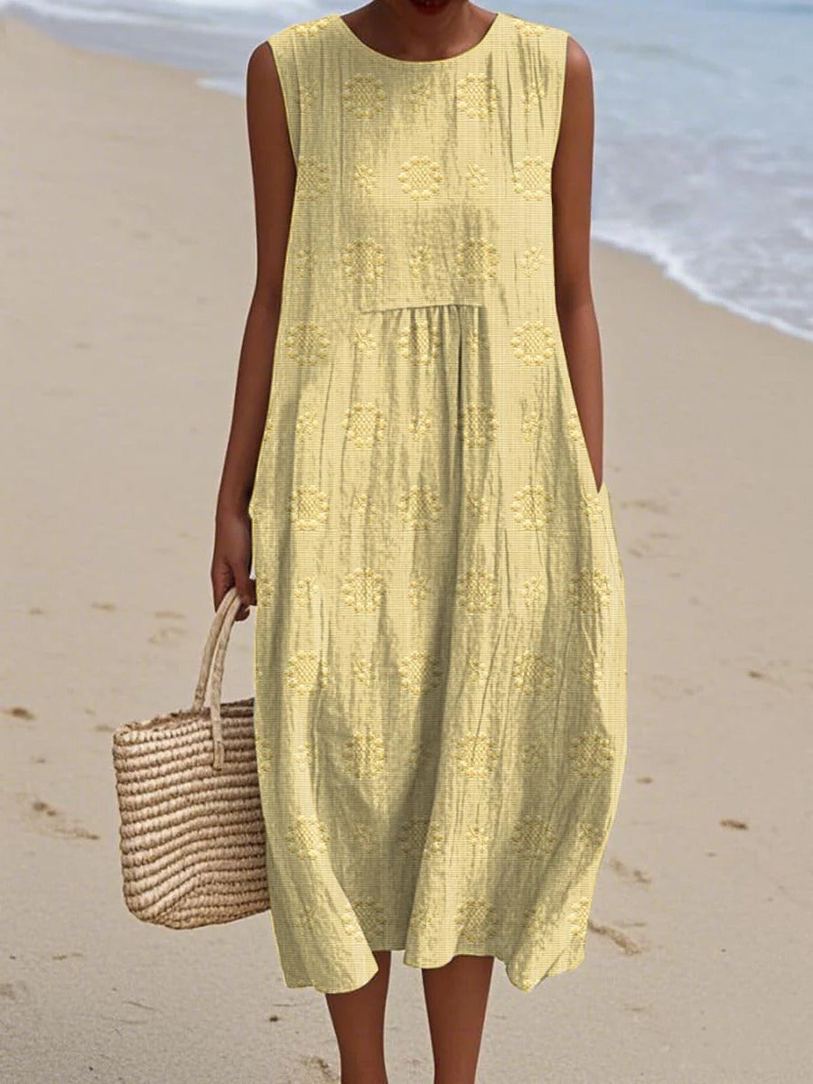 Women's sleeveless midi dress with embroidered circular motifs, breezy casual style for travel